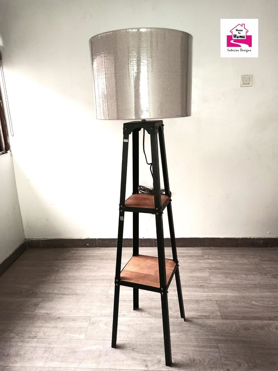 Tripod Standing lamp with wooden racks.